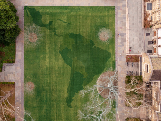 overview image of west campus quad with South American superimposed on the grass